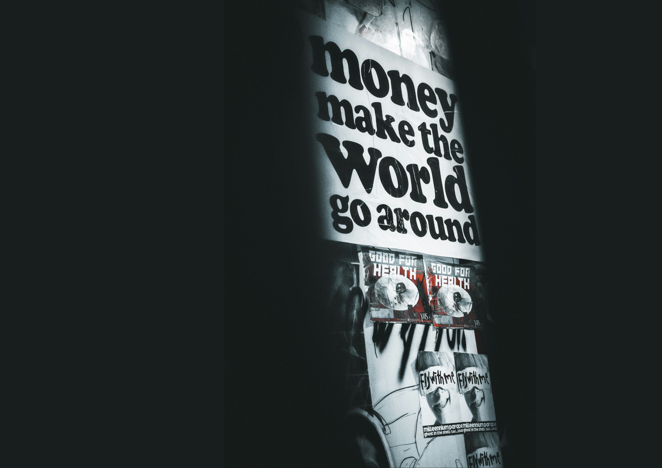 Graffiti-covered wall featuring the phrase 'money make the world go around,' visually emphasizing the article’s central theme of endemic corruption and the overpowering influence of money in Philippine politics and governance.